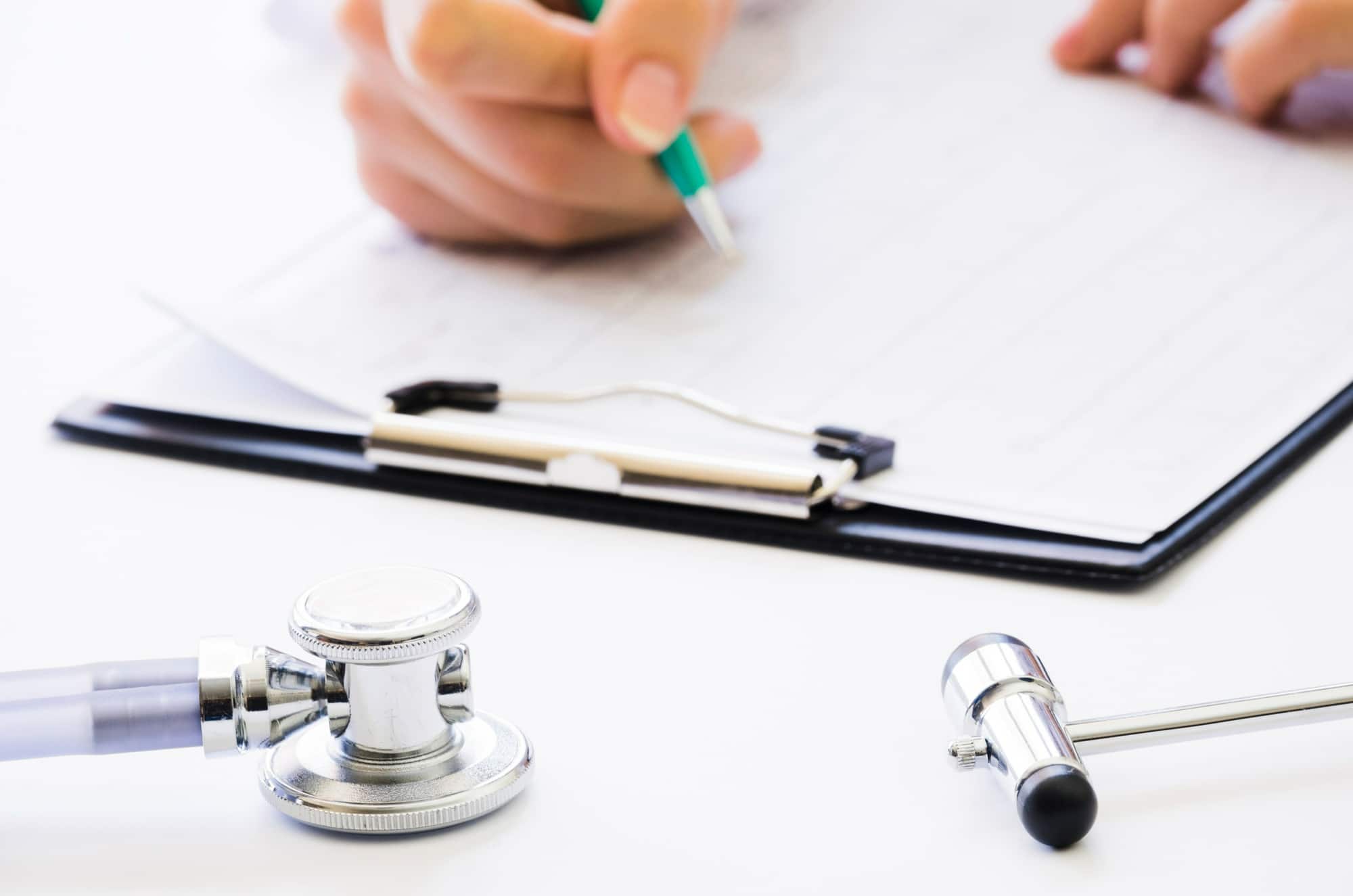 A healthcare professional reviewing a business associate agreement (BAA) draft to ensure HIPAA compliance.